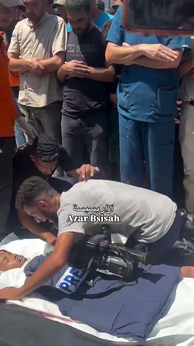 Funeral, camera & PRESS vest
